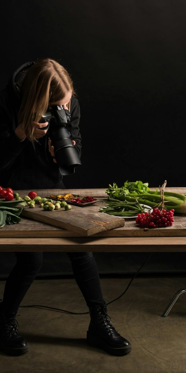 professional photographer making food composition for commercial photography and taking photo on